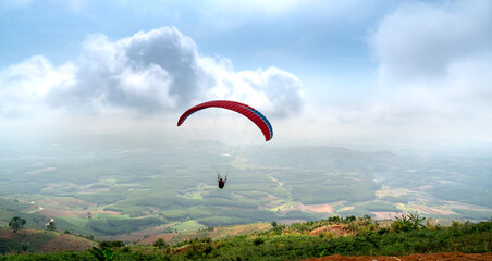 Paragliding on Chu Tan Kra mountain peak in Sa Thay district, Kon Tum province, Vietnam  