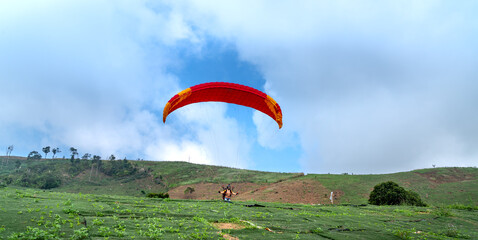 Paragliding on Chu Tan Kra mountain peak in Sa Thay district, Kon Tum province, Vietnam   © Quang