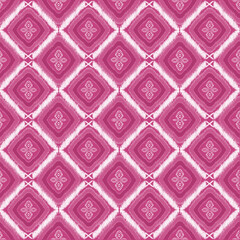 Abstract pink purple ethnic seamless pattern with rhombus or diamond shape on pink red background. Ideal for textile, ornament, wallpaper, print etc.,