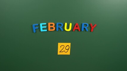 Hand sticking a sticker 29 February calendar day on school board. 29 date of February. Twenty ninth day of February. 29th date number. 29 day calendar. Twenty nine date. Leap month