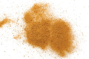 Pile of brown dust scattered on white background