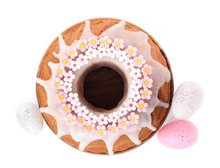 Festively decorated Easter cake and painted eggs on white background, top view