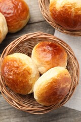 Freshly baked soda water scones on wooden table, flat lay