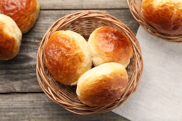 Freshly baked soda water scones on wooden table, flat lay