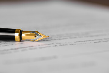 Fountain pen on document, closeup and space for text. Notary contract