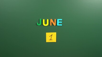 Hand sticking a sticker 1 June calendar day on school board. 1 date of June. First day of June. 1st date number. 1 day calendar. One date. Childrens, world milk