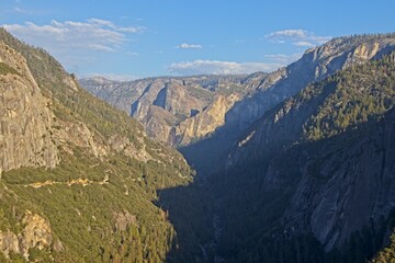The Merced River cuts through Yosemite Valley, a glacial valley in the Sierra Nevada mountain range of California.