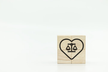 Ethical corporate culture concept, ethics inside human heart, business integrity and moral,wooden cubes with ethics inside a heart on white background. sustainable business