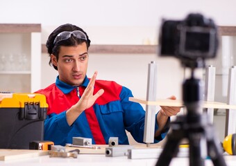 Young contractor recording video for his blog