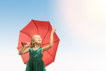  delight, emotional kid, little girl looking up on blue sky background.