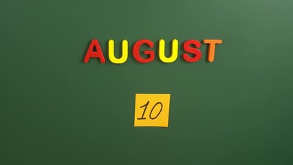 Hand sticking a sticker 10 August calendar day on school board. 10 date of august. Tenth day of august. 10th date number. 10 day calendar. Ten date. Independence day of Ecuador, Argentine Air Force