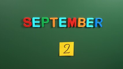 Hand sticking a sticker 2 September calendar day on school board. 2 date of September. Second day of September. 2nd date number. 2 day calendar. Two date. Vietnam independence day, End of World War II