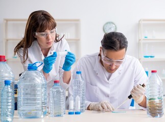 Two chemists working in the lab