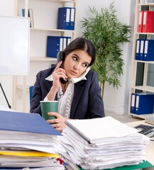 Female employee with too much work in the office