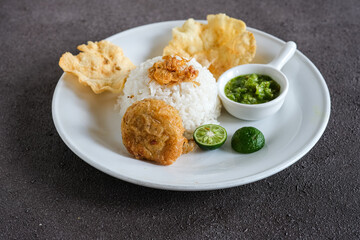 cooked rice with potatoes cake, chili and crackers
