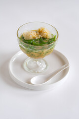 ice cendol is Indonesia sweet dessert made from mungbean flour and pandan leaf juice, served with coconut milk, palm sugar and shaved ice