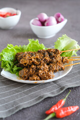 sate kerang, shell satay made from shell with spices like rendang. selective focus