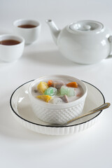 bubur chacha, coconut  milk sweet dessert with taro, sweet potato, palm seed, jelly tapioca. Indonesia dessert