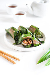 lemper, Indonesian food made from glutinous rice, filled chicken or shrimp, wrapped in banana leaf