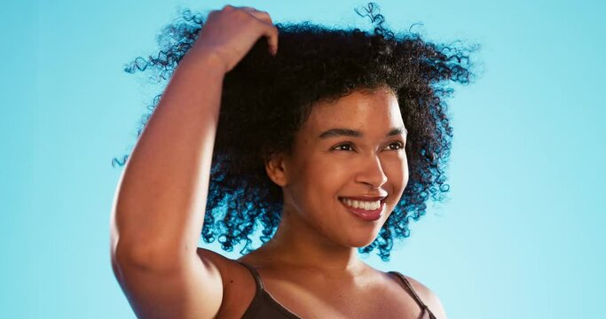 Hair care, cosmetics and black woman with beauty and healthy afro hairstyle texture with a smile. Natural, wellness and haircut treatment of a young model with happiness from skincare in studio