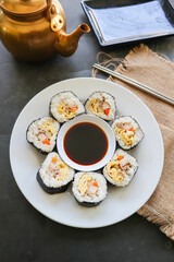 Fototapeta na wymiar kimbap or gimbap is Korean roll Gimbap (kimbob) made from steamed white rice (bap) and various other ingredients, this food from south korea
