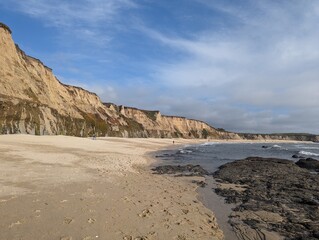 rocks on pacific ocean coastline in half moon bay beach