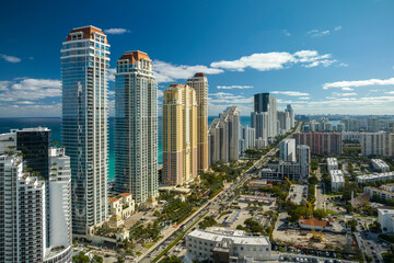 Aerial view of Sunny Isles Beach city with luxurious highrise hotels and condos on Atlantic ocean...