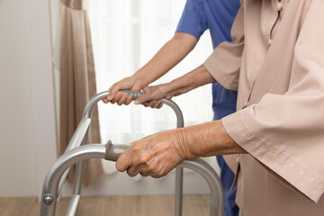 Caregiver takecare old woman that having Sarcopenia or muscle loss. Sarcopenia is a degenerative...