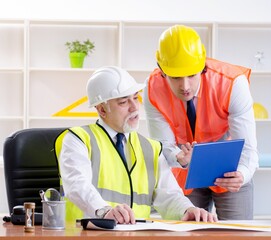 Two engineers colleagues working under project