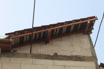 Fototapeta premium house building in the process of construction with white brick walls. suitable for the theme of the building process of construction