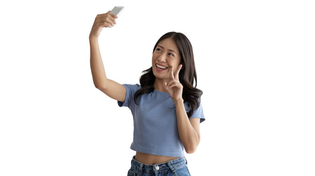 Cheerful young woman taking a selfie with a mobile phone and raising two fingers, Portrait of happy girl with bright face isolated on white background, Take a photo.
