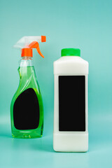 Eco-friendly glass cleaner.  Cleans car, glass, mirrors without streking. Safely cleans dirt, dust and greasy fingerprints. Spray bottle on a light blue background.  Place for text. Mockup