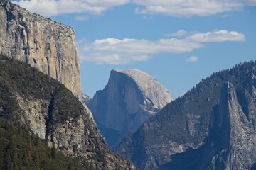 Fototapeta na wymiar Looking over Yosemite Valley, a glacial valley in the Sierra Nevada Mountain Range of California, from the Tunnel View turnout on a beautiful fall day.