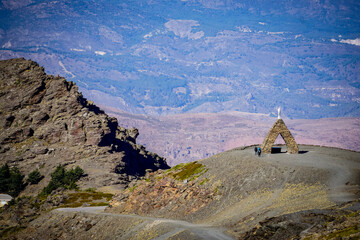 Landscape of the Alpujarras of Granada with the monument to the Virgen de las Nieves in the...