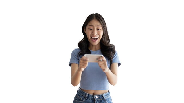 Asian Woman Playing Games On Mobile Phone And Wearing Headphones Having Fun, Play Games On The Sofa In The Living Room On Weekends, Resting At Home, Comfort Zone, Touch Screen Mobile Phone.