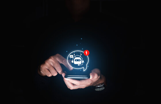 Chat with AI or Artificial Intelligence technology, Hand of businessman using smartphone with chatbot notifications, chatting communication.