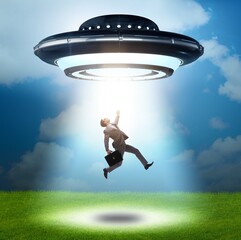 Flying saucer abducting young businessman