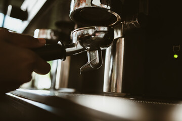 barista use coffee machine with bottomless filter. coffee maker concept.