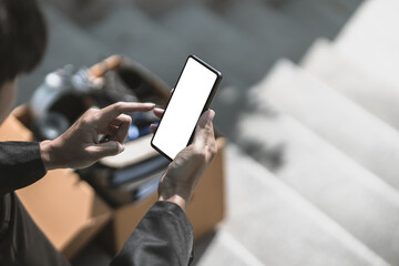 Employees fired or resigned from the company are using their mobile phones to find a jobs..Unemployed, hiring job, quitting job concept.