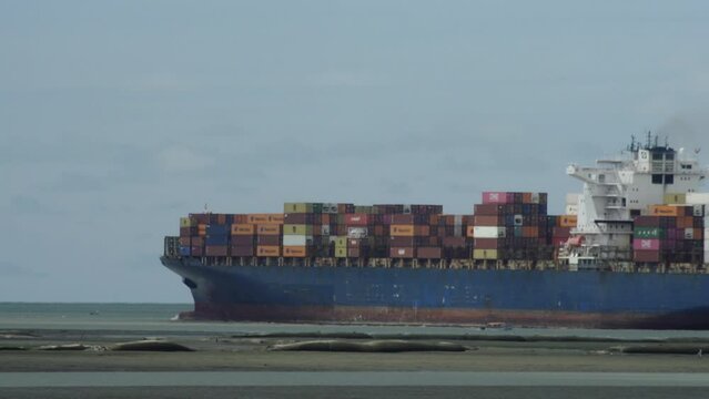 Telephoto shot of big cargo ship going out of Buenaventura, Colombia