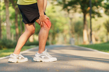 Young adult male with muscle pain during running. runner have knee ache due to Runners Knee or...