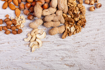 Fototapeta premium Dried fruits and nuts on wooden background. Healthy food