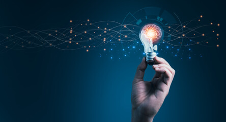 Man holding illuminated light bulb like as business innovation idea and creativity brainstorming