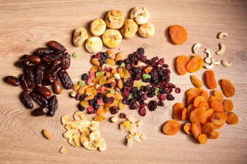 Dried fruits on wooden background in studio photo