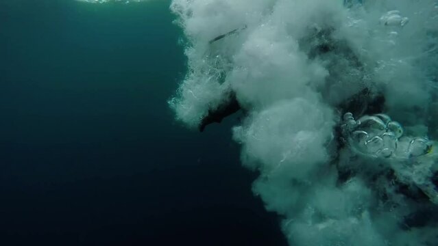 Boat Diving - Scuba Diver Jumps from a Dive Boat. Scuba Diver in Action. Open Water Diving. Scuba Diving Tourism. Health Benefits of Scuba Diving. High speed Camera Shot. Active Lifestyle.