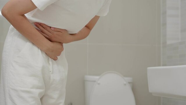 Constipation and diarrhea in bathroom. Hurt woman touch belly  stomach ache painful. colon inflammation problem, toxic food, abdominal pain, abdomen, constipated in toilet, stomachache, Hygiene