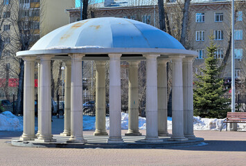An empty park rotunda on a spring day