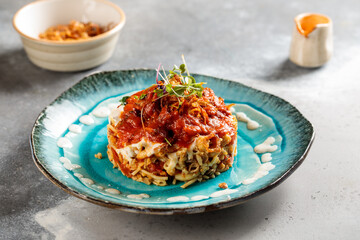 Kushari served in dish isolated on table top view of arabic breakfast