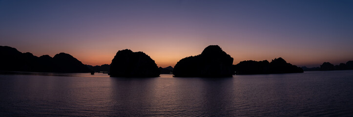 Panoramic view on amazing sunset at Ha Long Bay. South China Sea, Vietnam