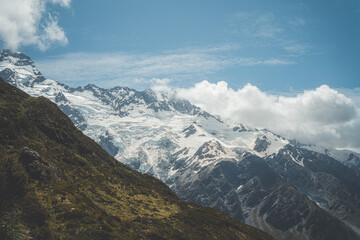 Snow capped mountains and low clouds